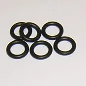 A group of six black rubber rings sitting on top of a table.