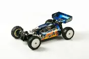 A blue and black remote control car on the floor