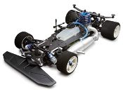 A remote controlled car with the engine and body exposed.