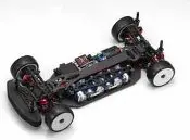 A model car with many batteries on the floor.