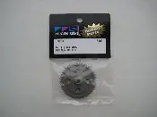 A small metal wheel in its packaging.