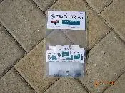 A package of stickers and some papers on the ground.