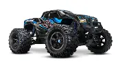 A blue and black monster truck is parked.