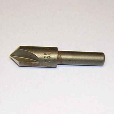 A close up of an arrow shaped drill bit