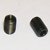 A close up of two black metal screws