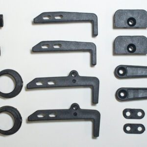 Assorted black plastic hardware components arranged neatly.